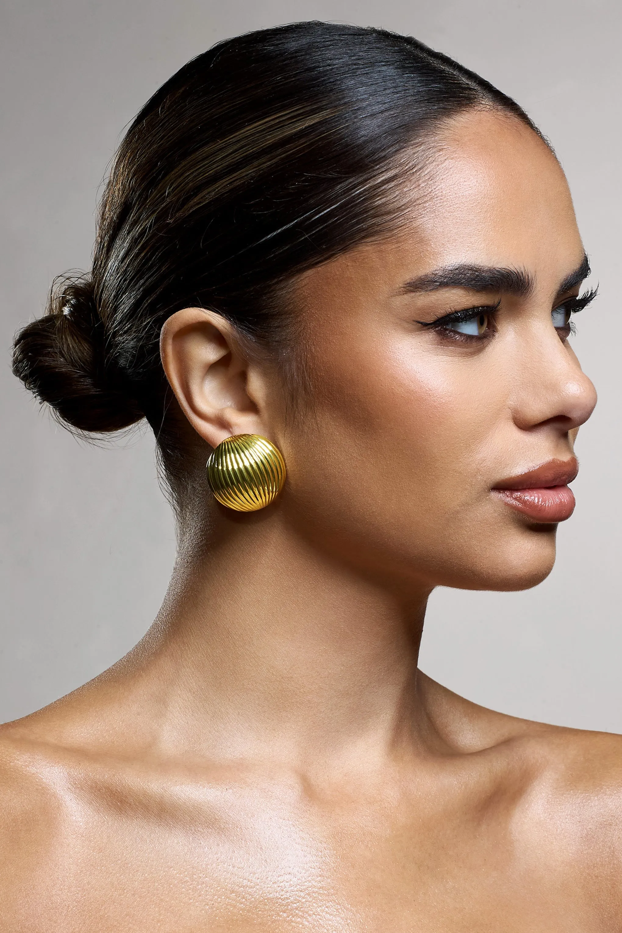 Leonardo | Gold Ribbed Circle Statement Earrings sold by Club L London
