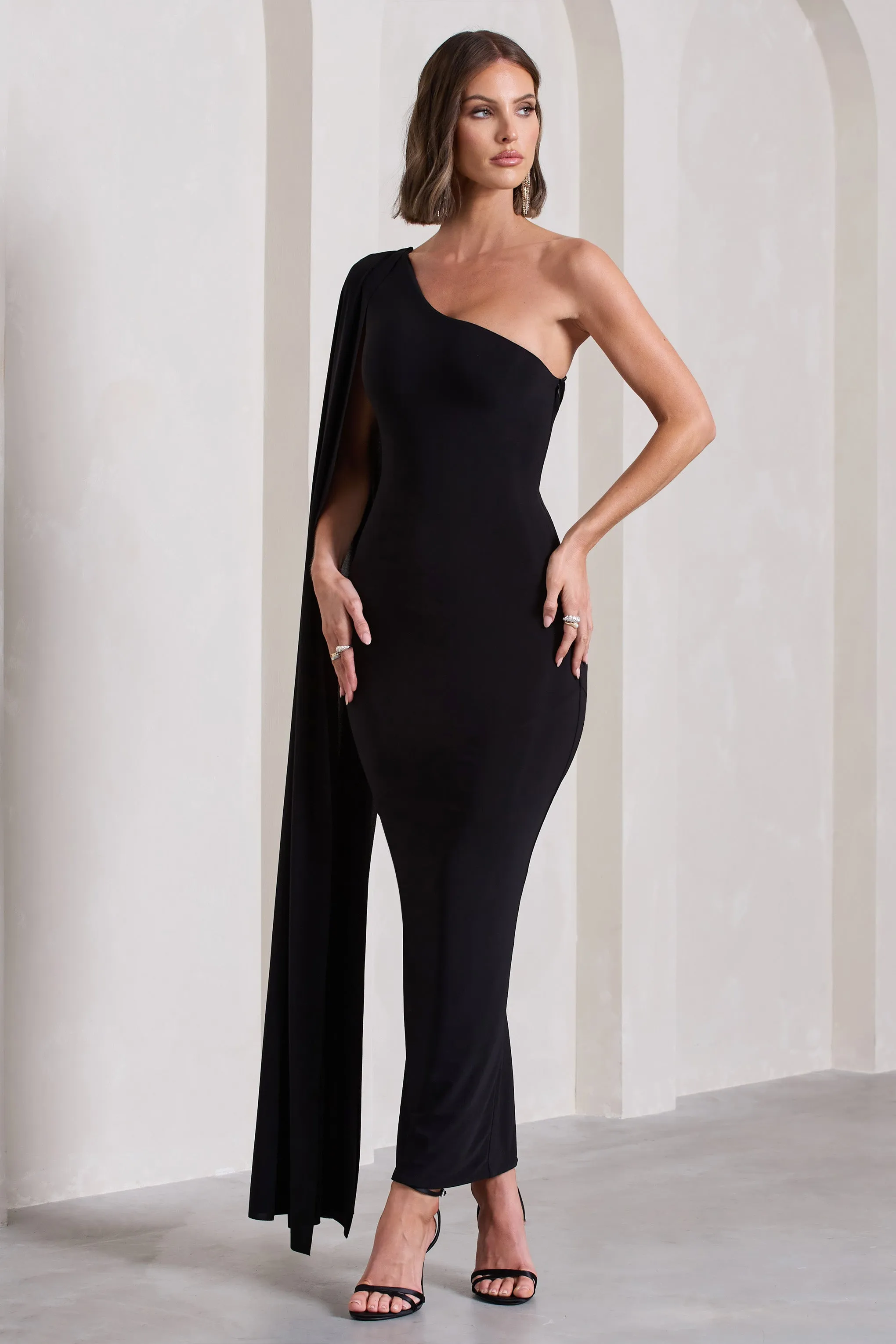 Kamila | Black One Shoulder Cape Sleeve Open-Back Maxi Dress sold by Club L London