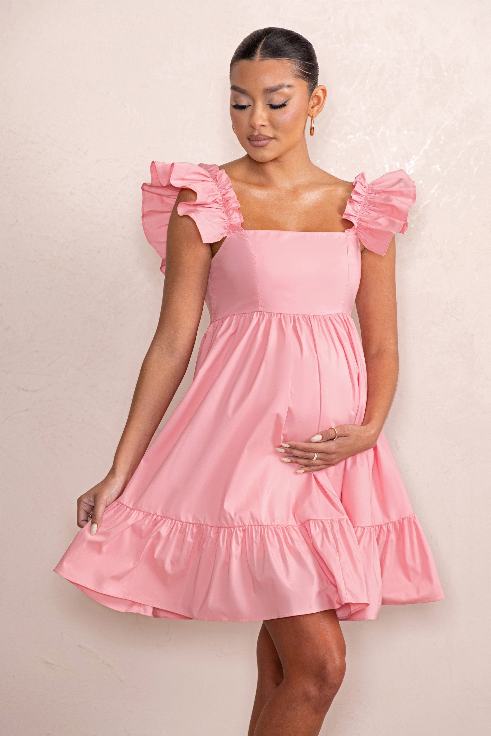 Dolly Daze | Blush Ruffle Sleeve Babydoll Maternity Mini Dress sold by Club L London