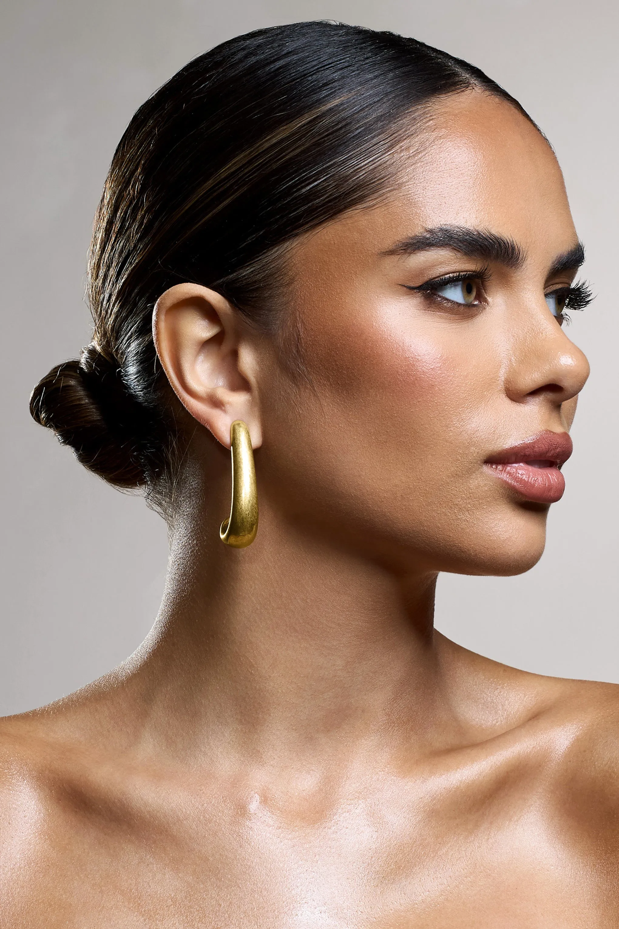 Zariah | Gold Curve Earrings sold by Club L London product image thumbnail 3