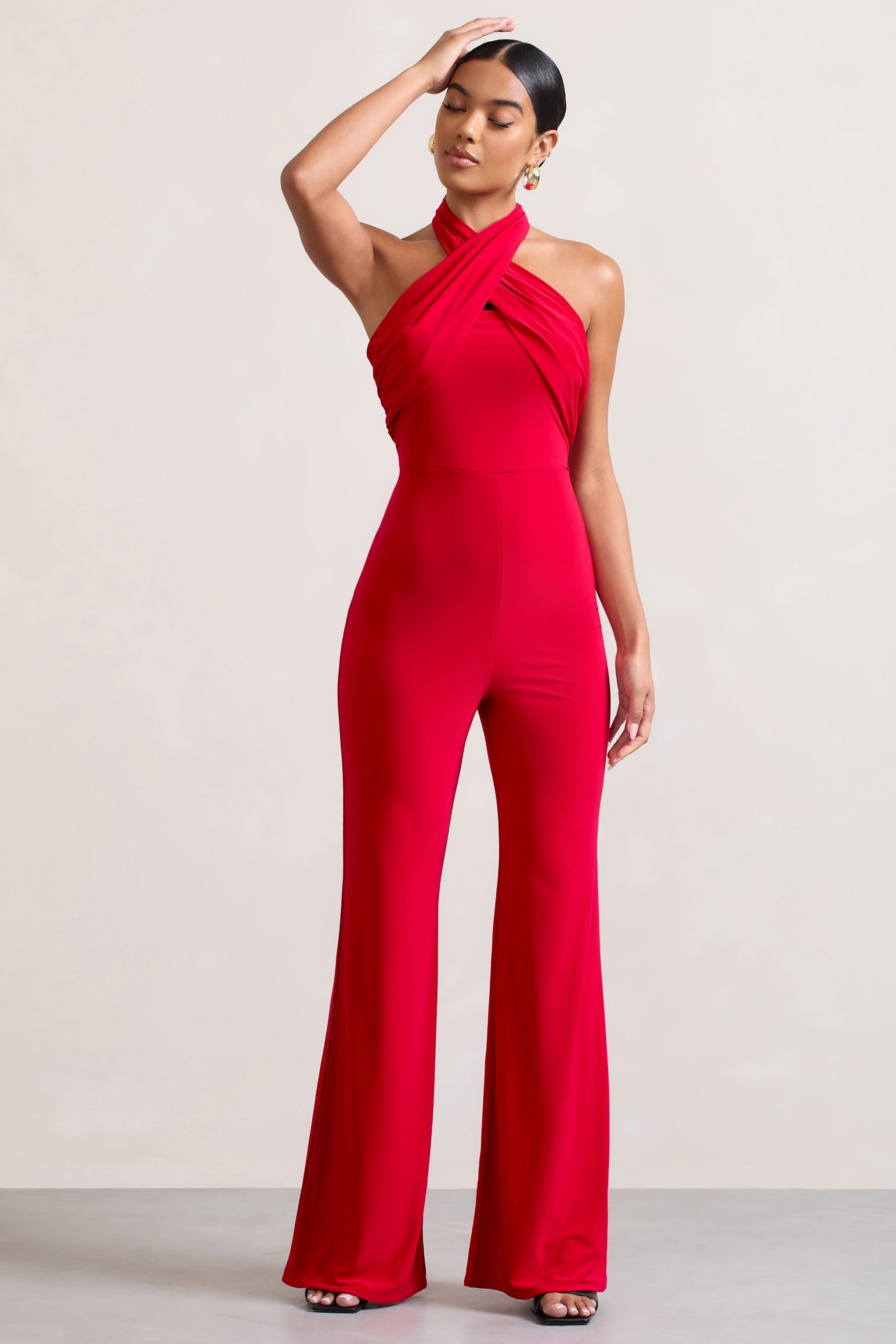 Goddess | Red Halter Neck Flare Jumpsuit sold by Club L London