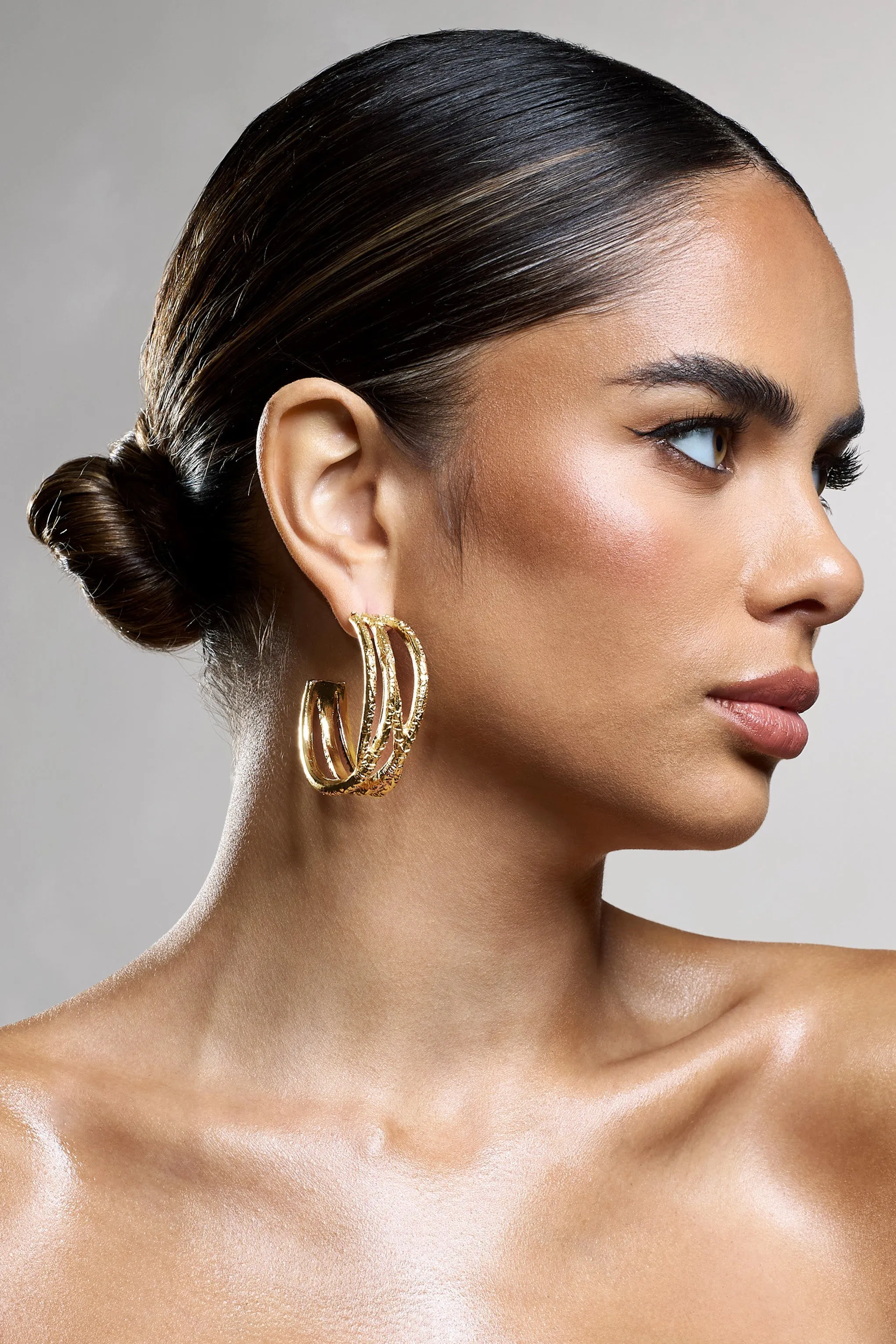 Mambo | Gold Layered Hoop Earrings sold by Club L London
