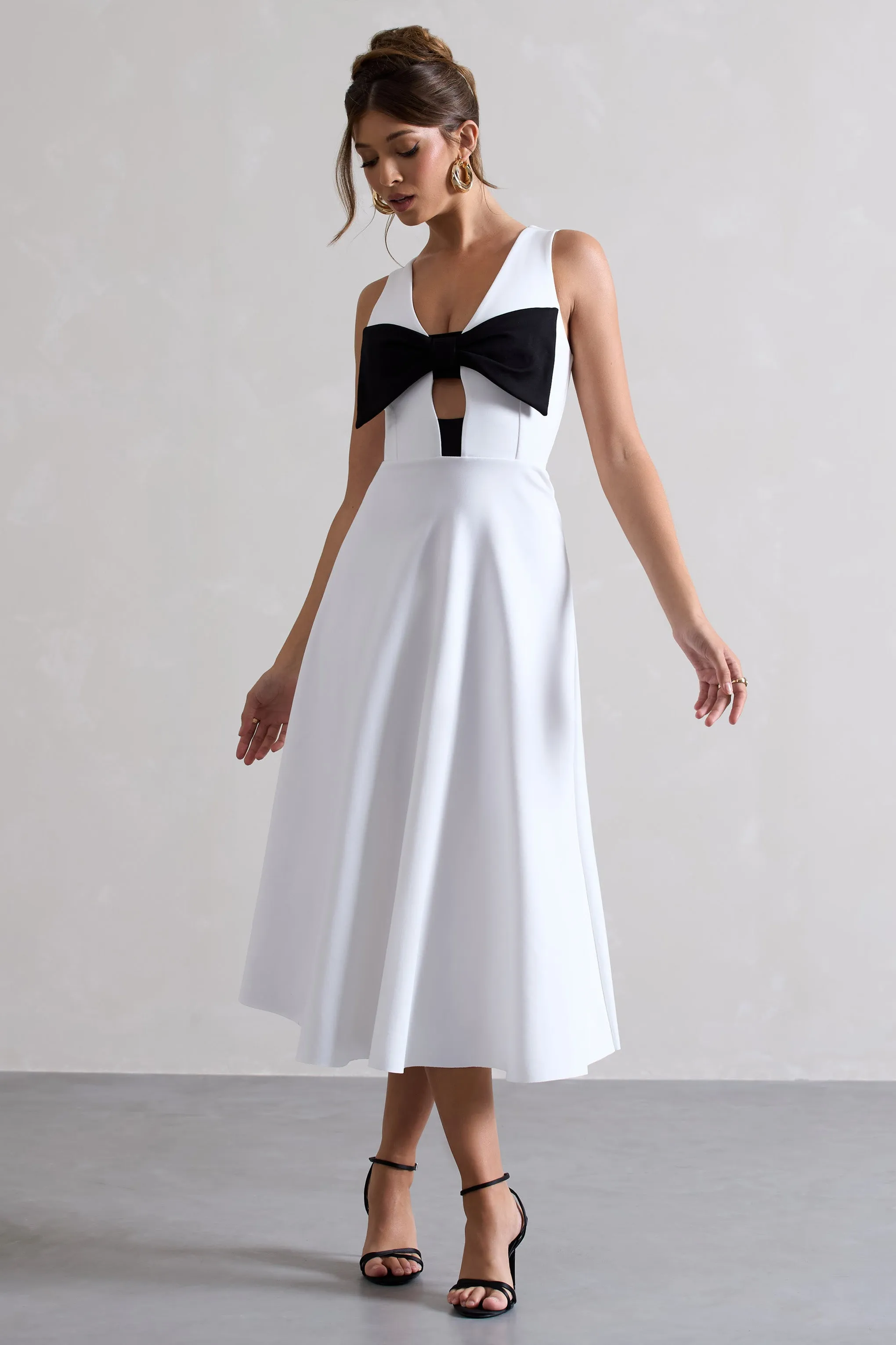 Primrose | White Plunge-Neck Midi Dress With Black Bow sold by Club L London