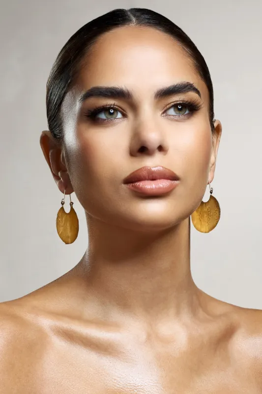 Calista | Gold Textured Disc Earrings sold by Club L London