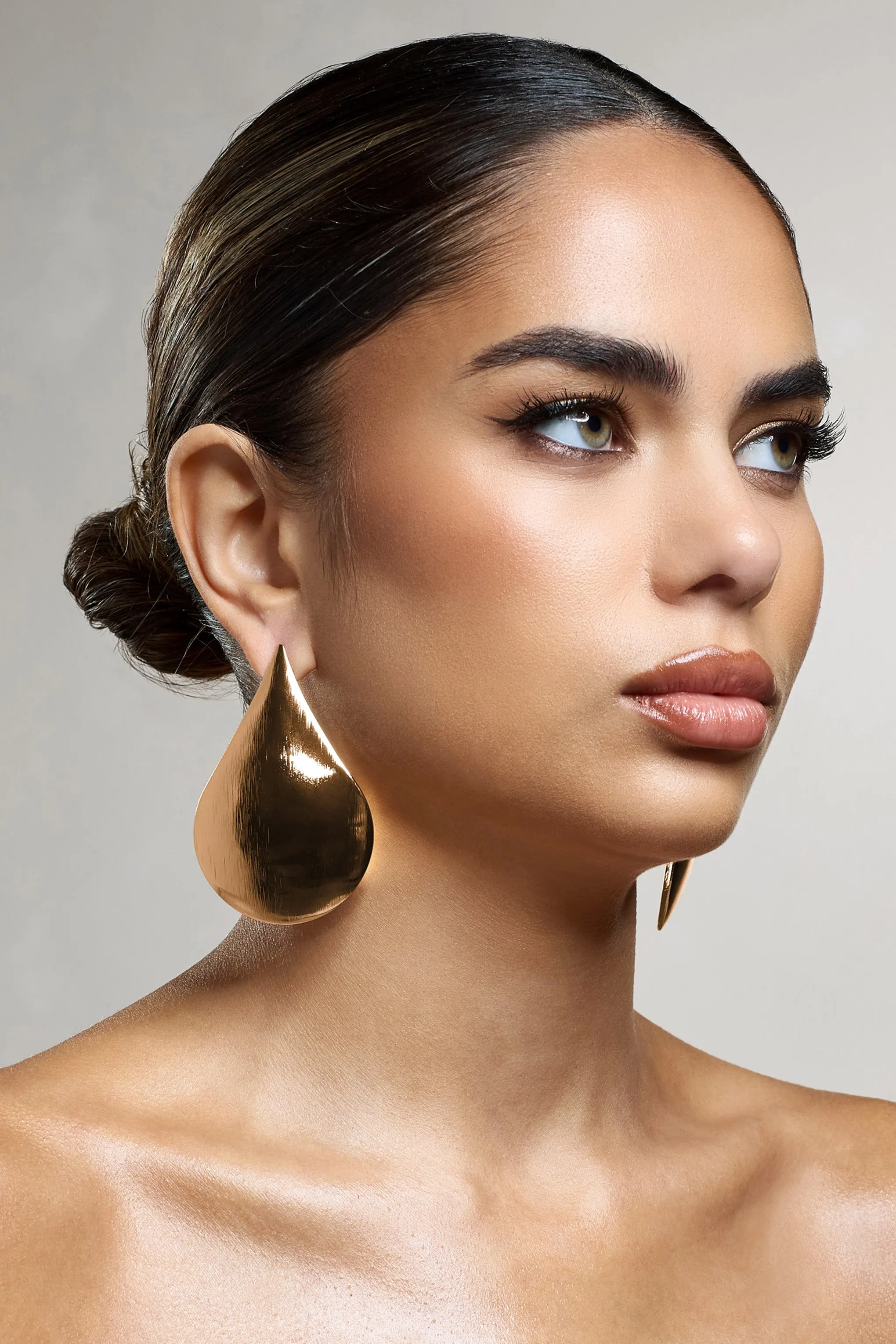 Droplet | Gold Statement Teardrop Earrings sold by Club L London