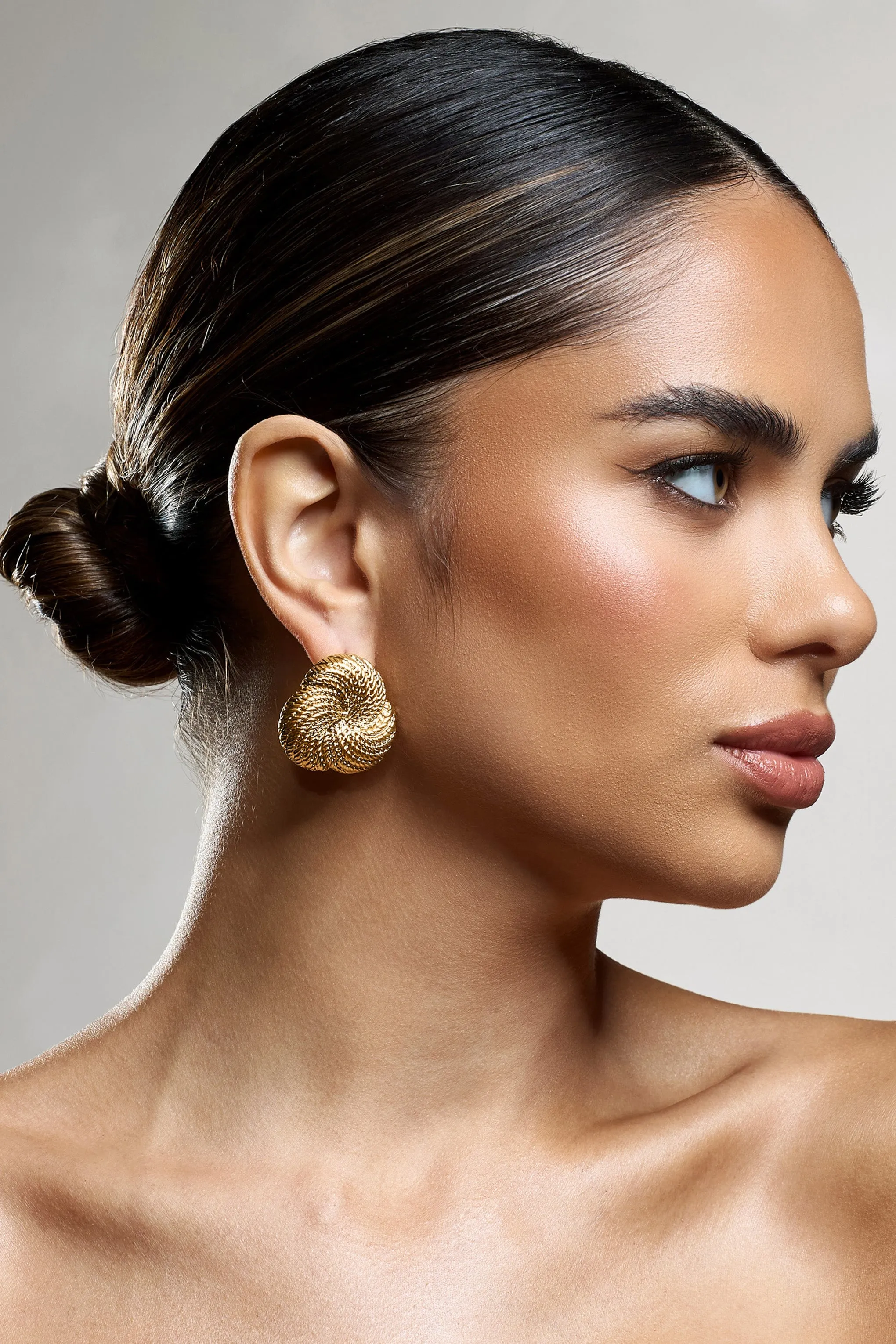 Criss Cross | Gold Chunky Knot Earrings sold by Club L London