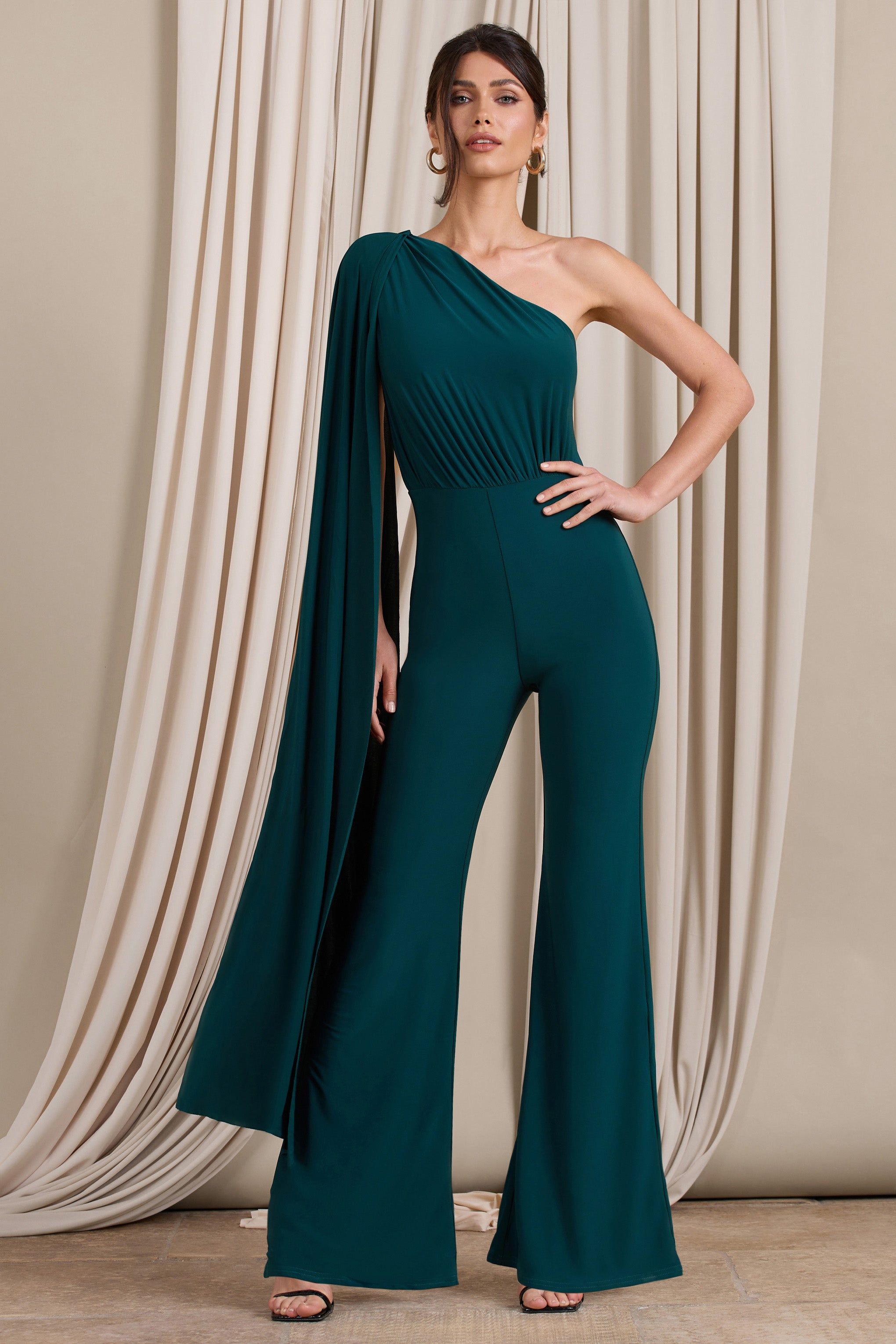 Aurora | Deep Green One Shoulder Cape Sleeve Jumpsuit sold by Club L London