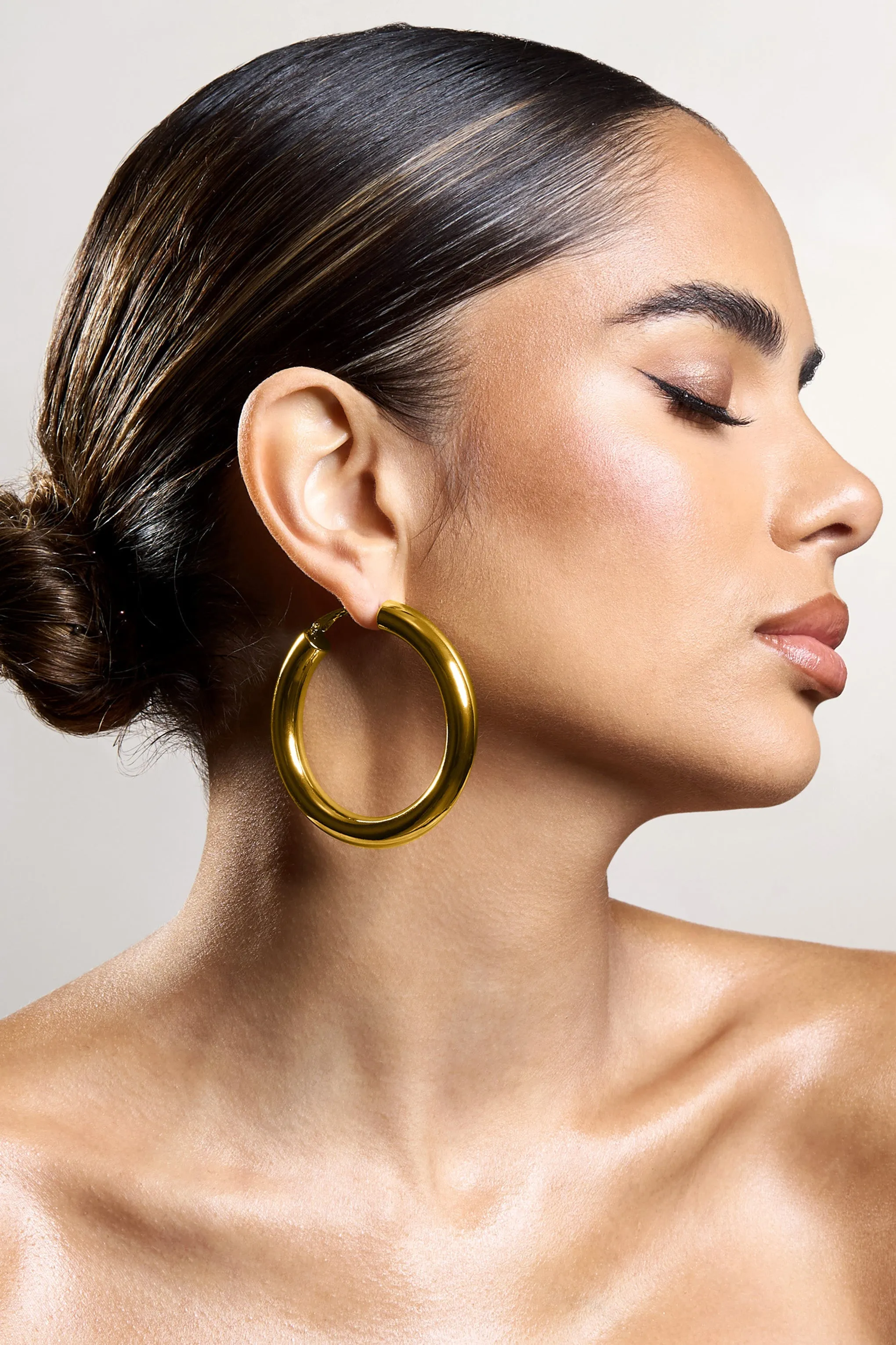 Logan | Gold Chunky Hoop Earrings sold by Club L London