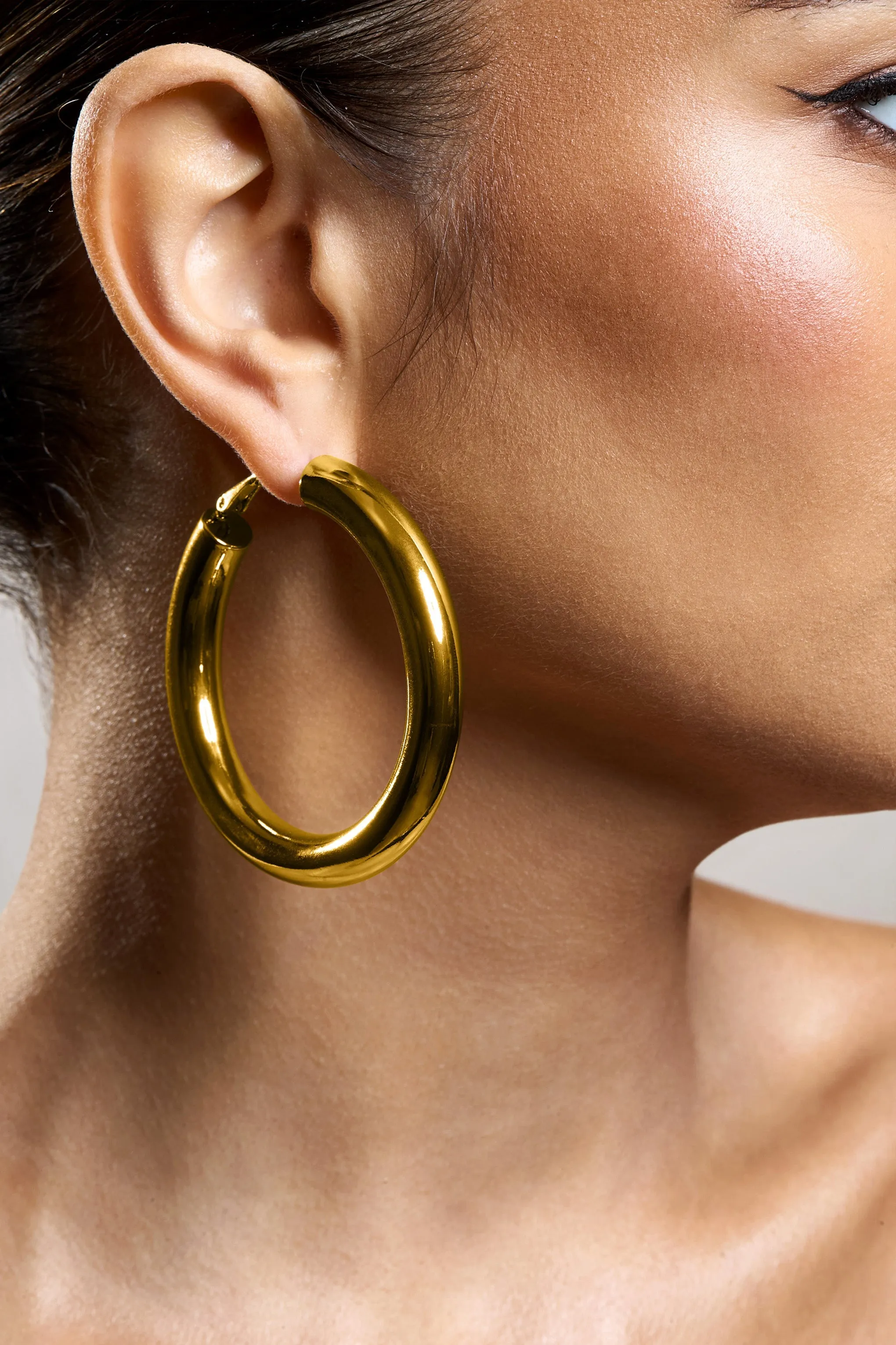 Logan | Gold Chunky Hoop Earrings sold by Club L London product image thumbnail 4