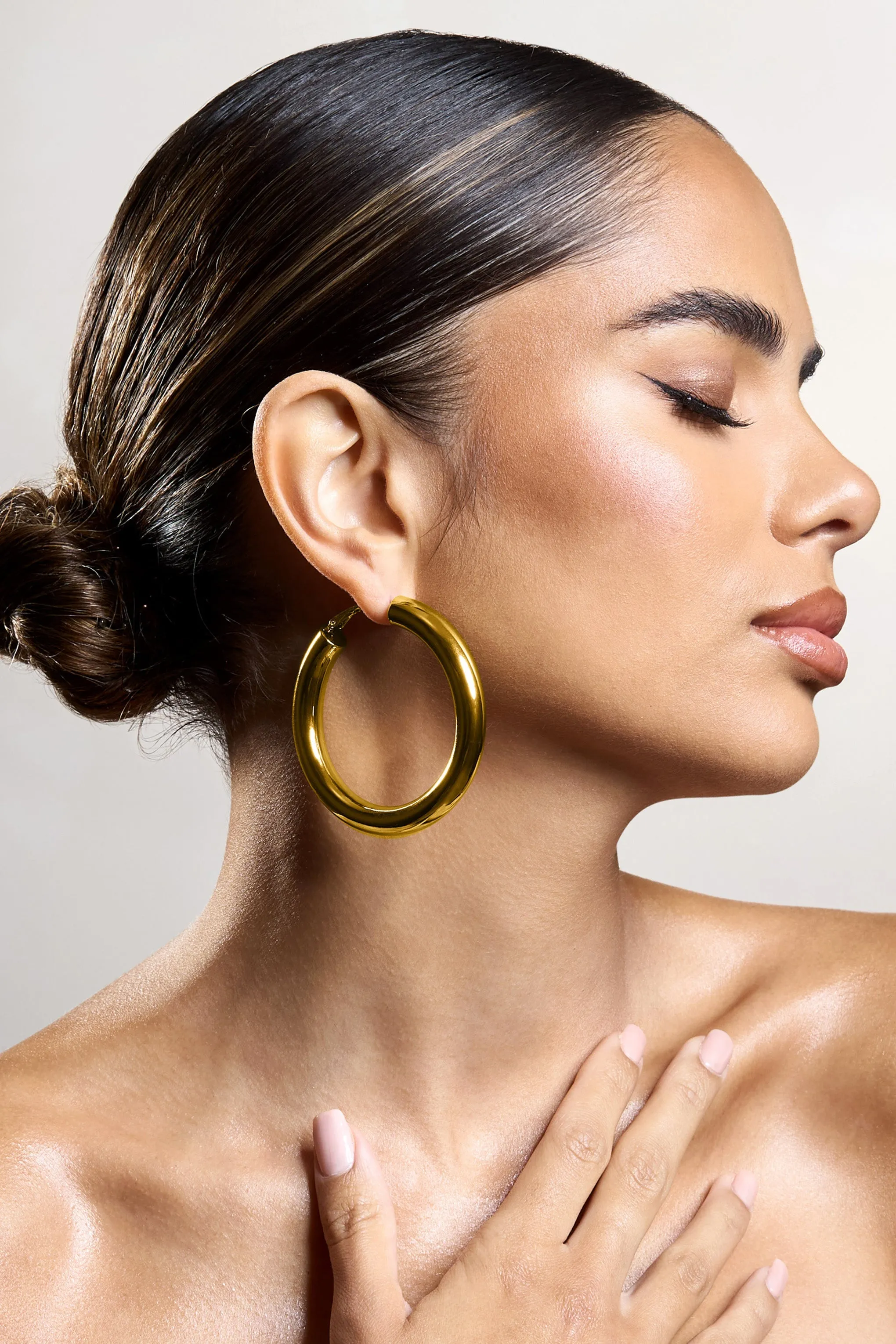 Logan | Gold Chunky Hoop Earrings sold by Club L London product image thumbnail 3