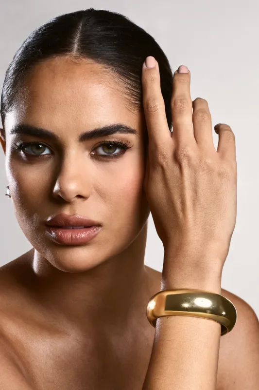 Bayshore | Gold Chunky Bangle sold by Club L London