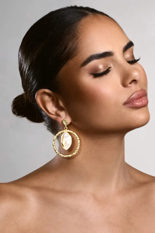 Waves | Gold Circle Drop Earrings With Iridescent Shells sold by Club L London