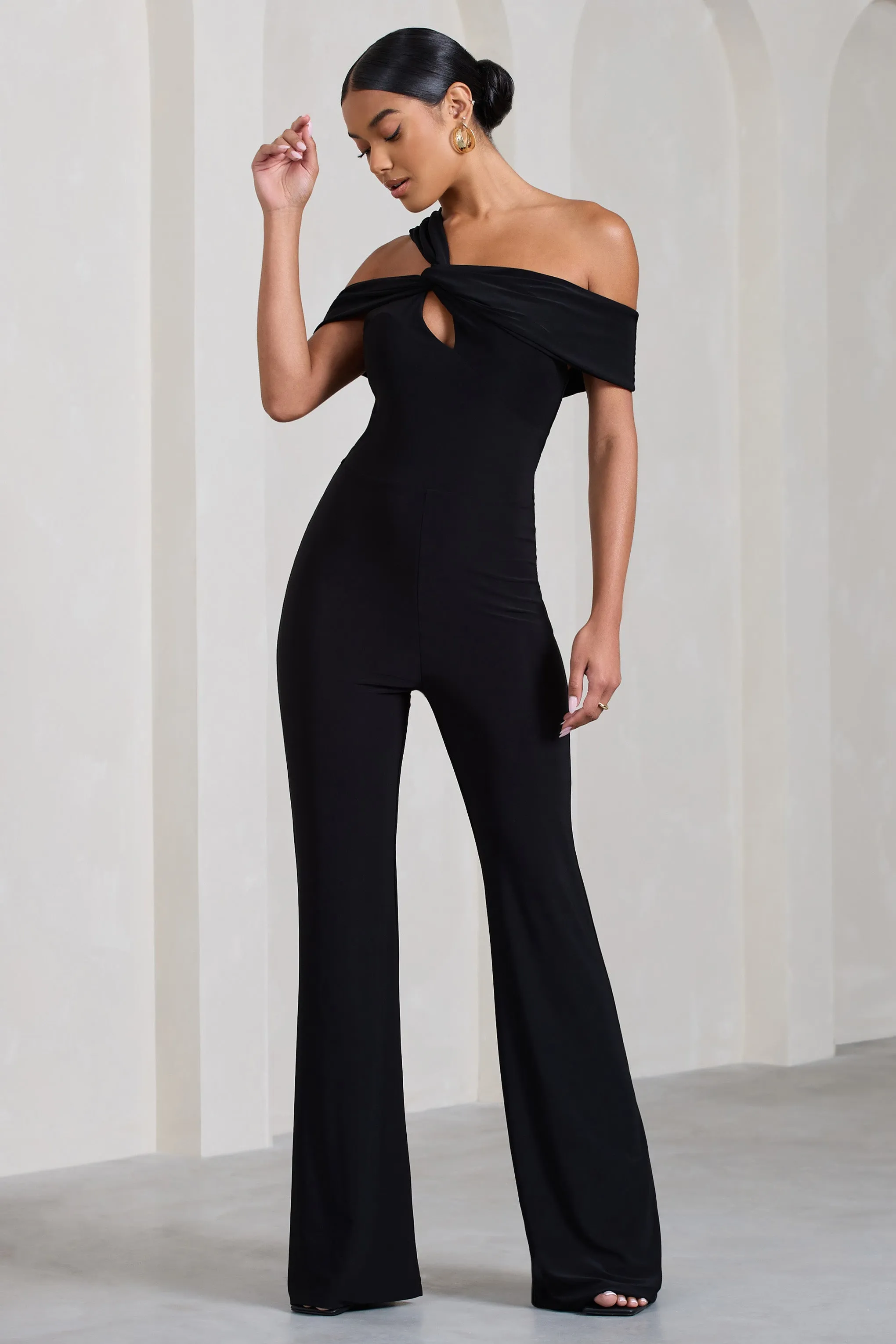 Striking | Black Strappy Asymmetric Flared-Leg Jumpsuit sold by Club L London