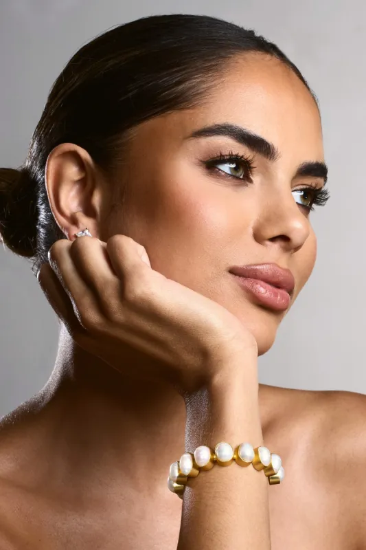 Pebbles | Gold Iridescent Shell Chunky Bangle sold by Club L London