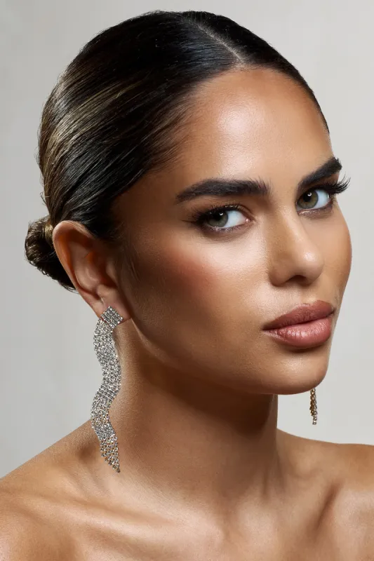 Swirl | Gold Diamante Curve Tassel Earrings sold by Club L London