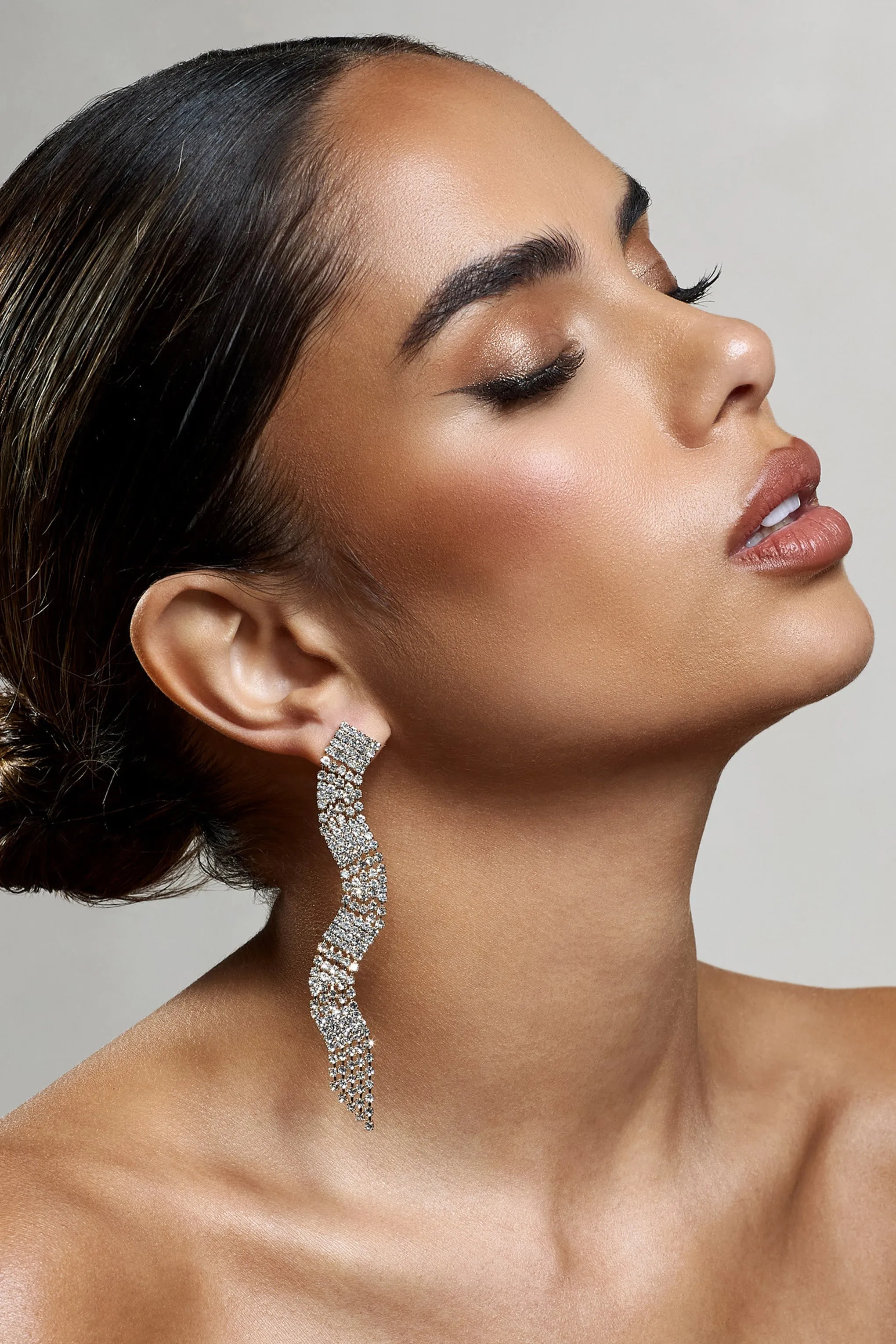 Swirl | Gold Diamante Curve Tassel Earrings sold by Club L London product image thumbnail 2