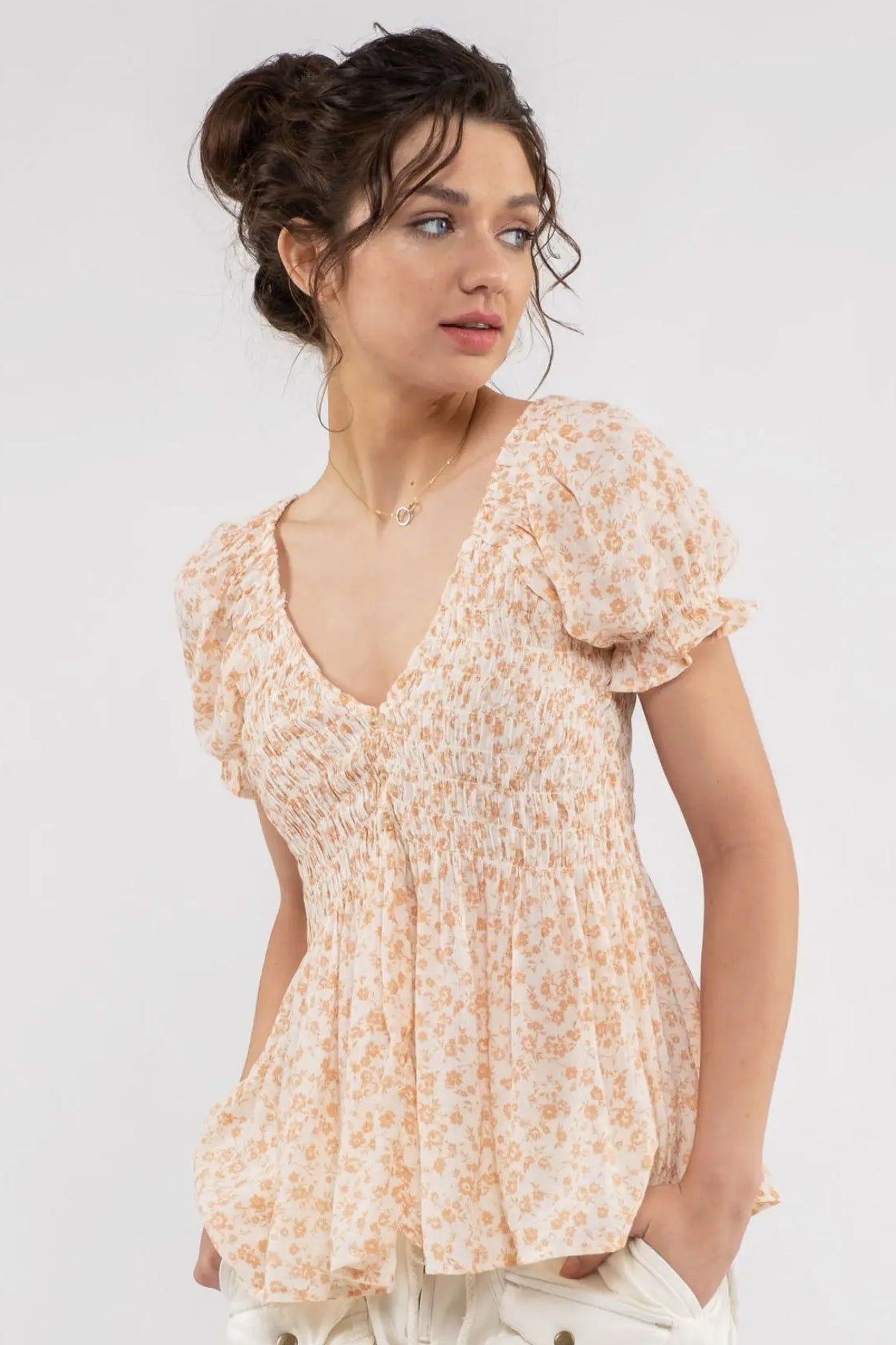 Smocked Floral Blouse sold by Valencia Boutique