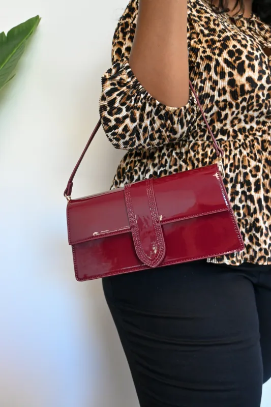 Violet Patent Handbag sold by Valencia Boutique