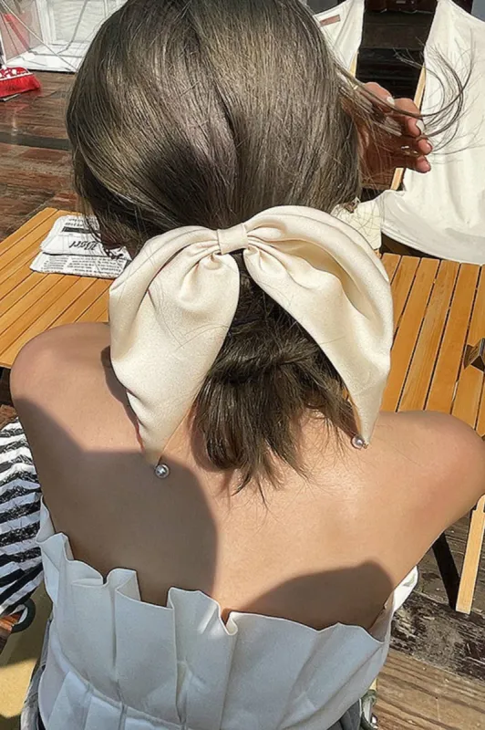 Satin Bow Pearl Clip sold by Valencia Boutique