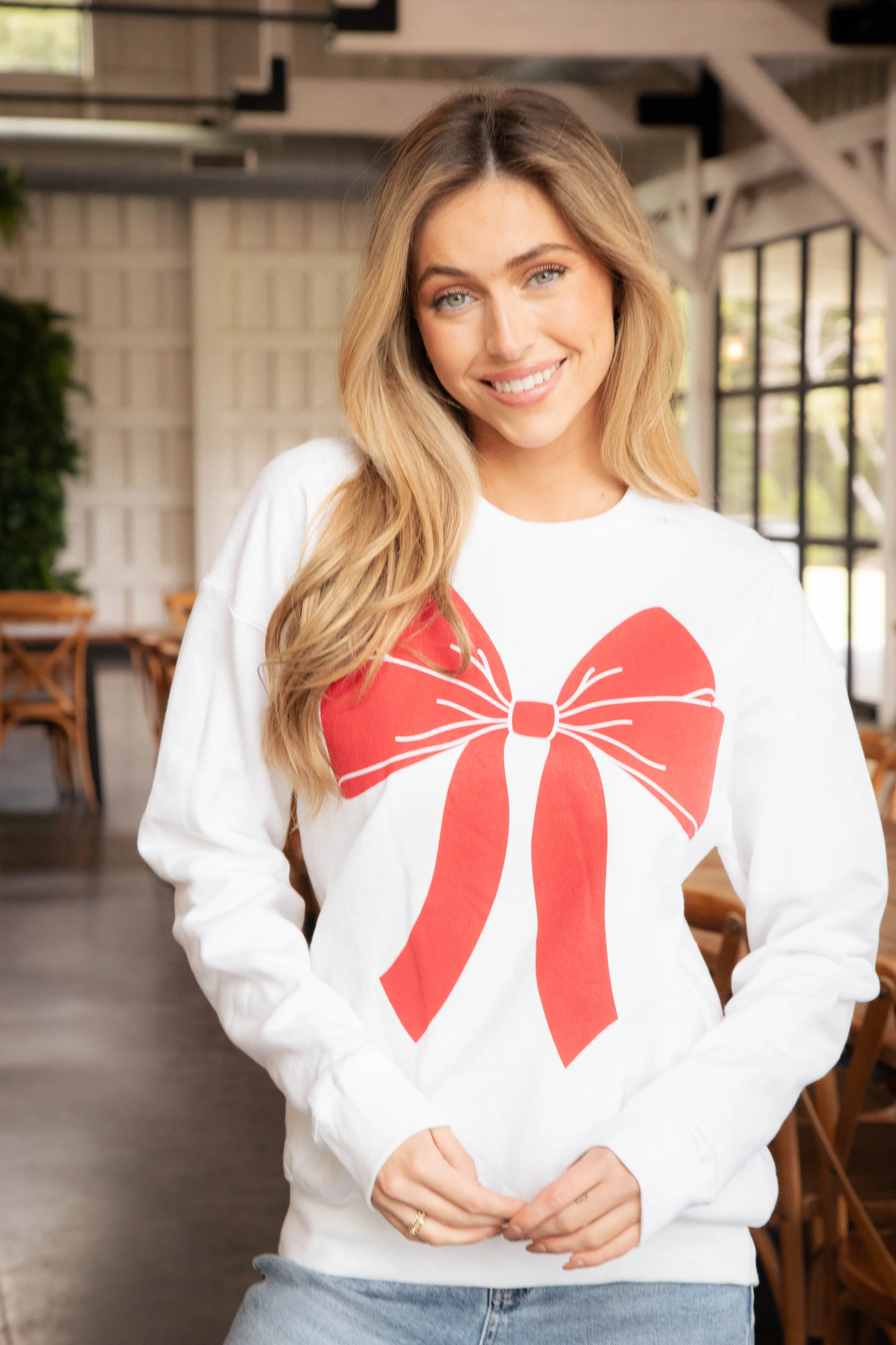 Christmas Bow Sweatshirt, White/Red sold by North & Main Clothing Company