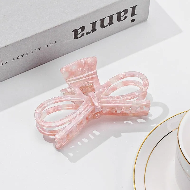 Large Plastic Bow Ribbon Hair Claw, Pink sold by North & Main Clothing Company