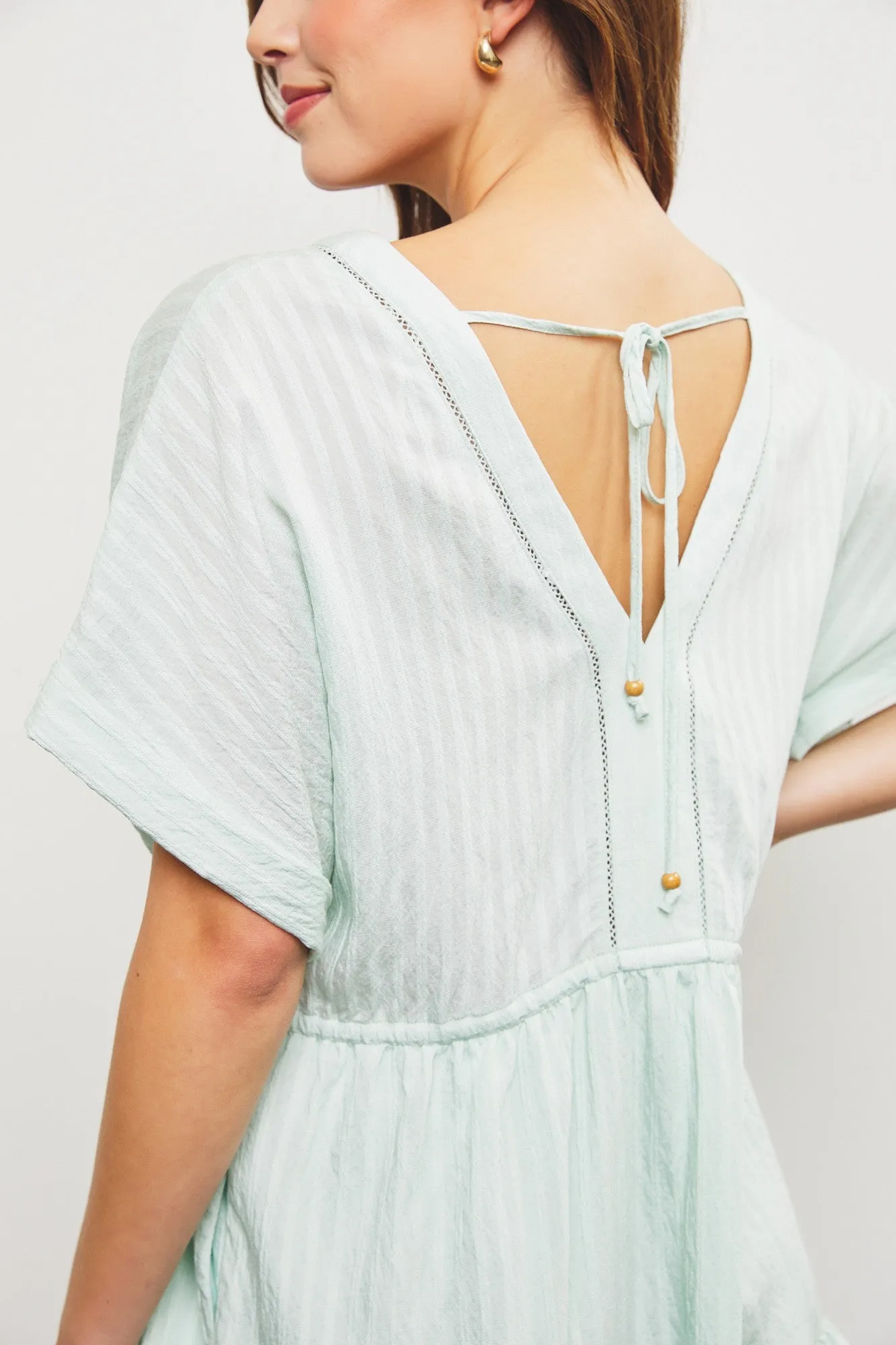 Aurora V-Neck Ruffle Hem Dress, Pistachio sold by North & Main Clothing Company product image thumbnail 5