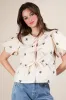Clara Front Tie Bow Embroidered Top, Beige sold by North & Main Clothing Company
