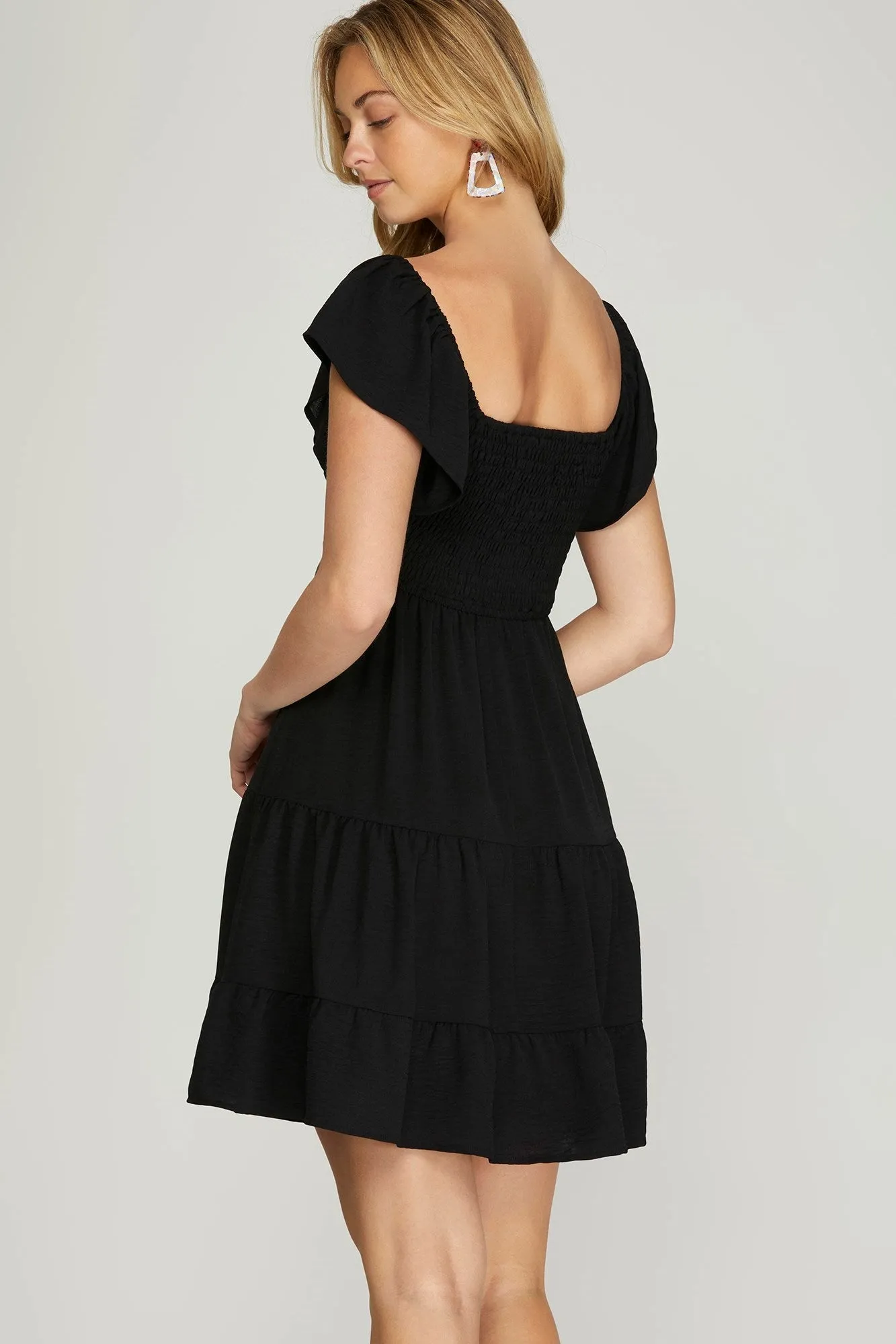 Katie Flutter Sleeve Smocked Mini Dress, Black sold by North & Main Clothing Company product image thumbnail 2