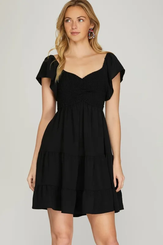 Katie Flutter Sleeve Smocked Mini Dress, Black sold by North & Main Clothing Company