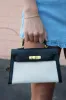 Wynter Small Top Clutch Bag, Black sold by North & Main Clothing Company