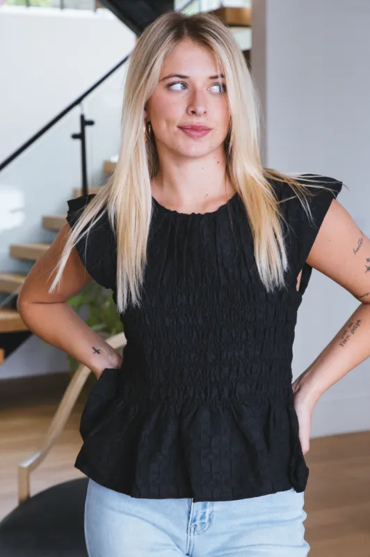 Quinn Flutter Sleeve Peplum Top, Black sold by North & Main Clothing Company