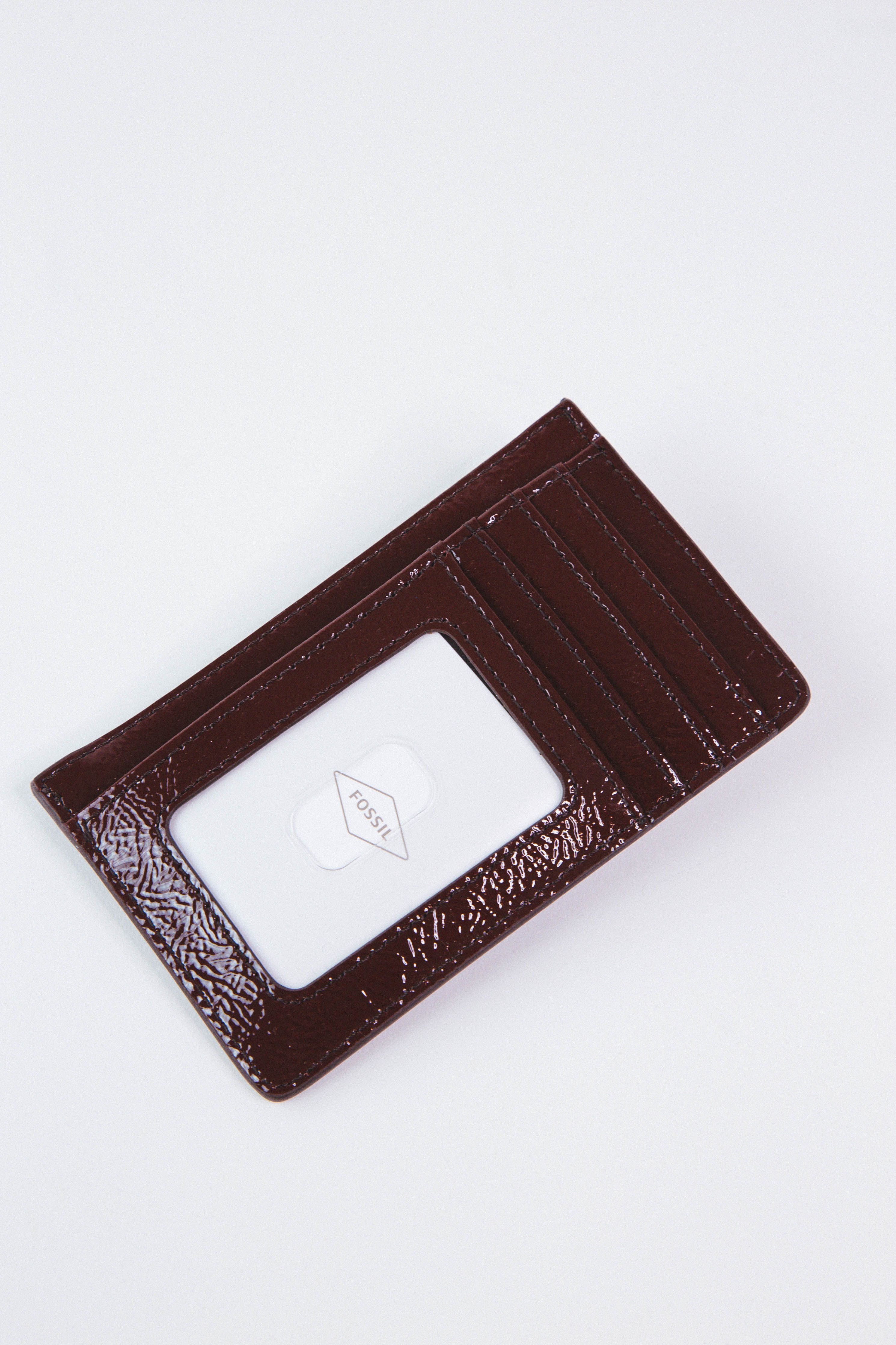 Logan Zip Coin Wallet, Red Mahogany | FOSSIL sold by North & Main Clothing Company