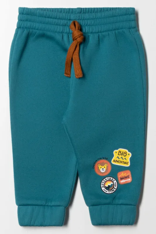 Badges Track Pants Blue sold by Ackermas
