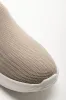 Knit Trainer With Metal Trim Natural sold by Ackermas
