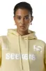 Seekers Motif Hoodie in Butter Yellow sold by Sisters and Seekers
