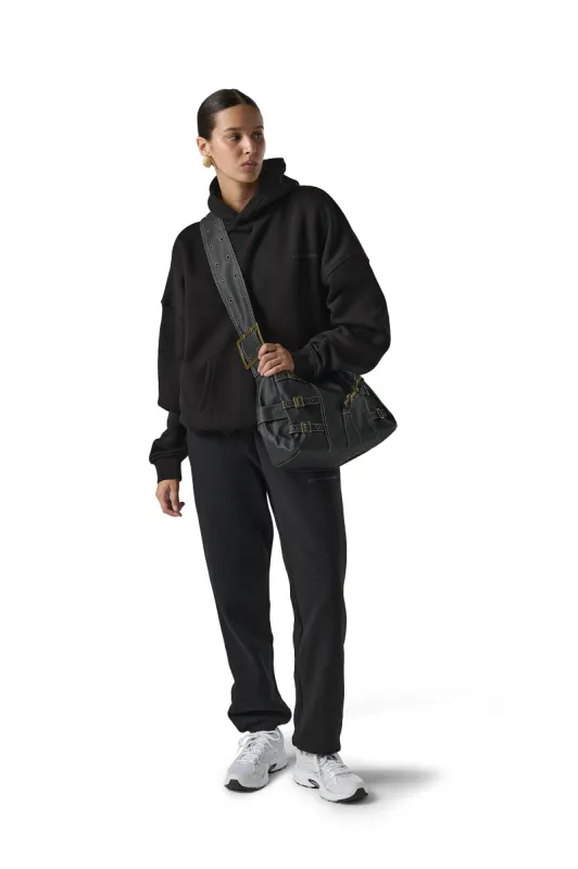 Lumber Buckle Bag sold by Sisters and Seekers