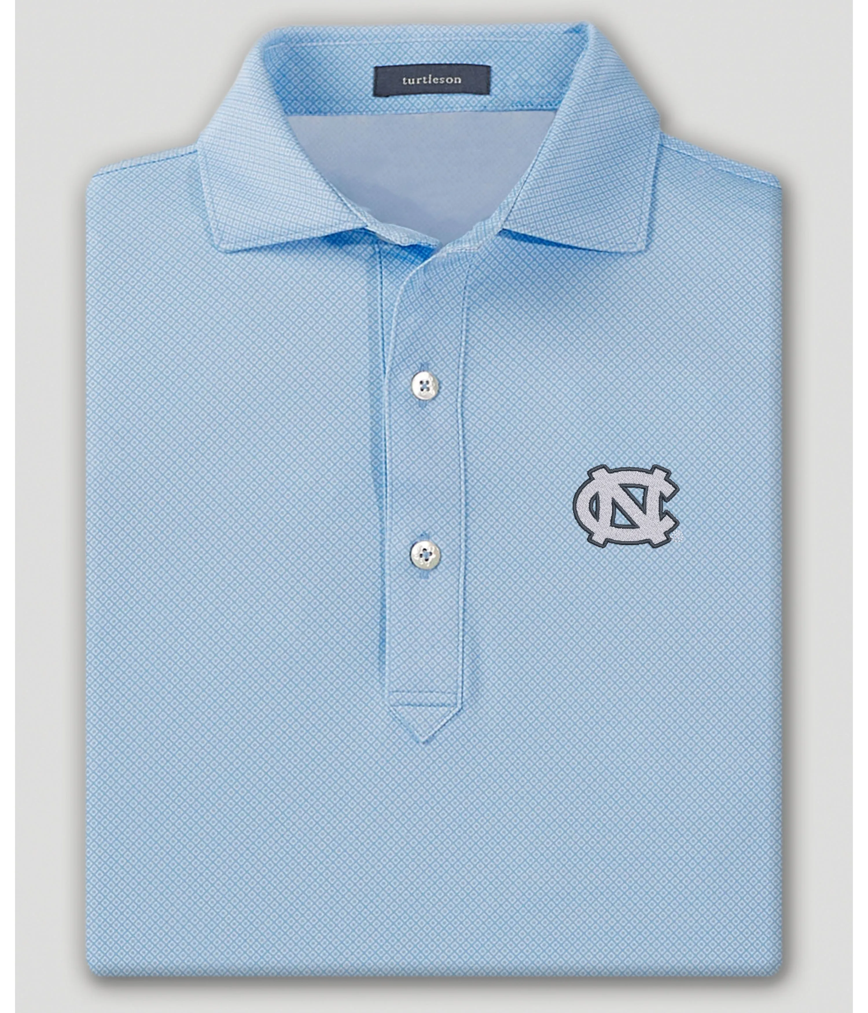 Clarence Performance Polo - North Carolina Tar Heels sold by Turtleson