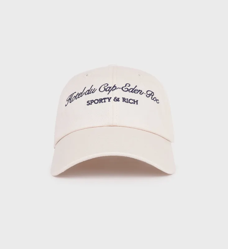 Hotel du Cap Cursive Hat - Cream/Navy sold by Sporty and Rich