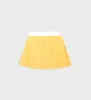 Classic Logo Pleated Tennis Skirt - Yellow/White sold by Sporty and Rich