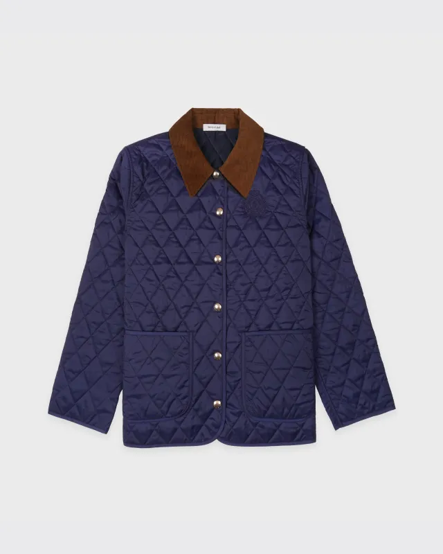NY Crest Nylon Quilted Jacket - Navy/Tan sold by Sporty and Rich
