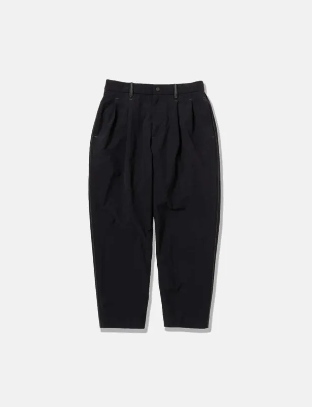 And Wander Plain Tapered Stretch Pants - Black sold by Article London