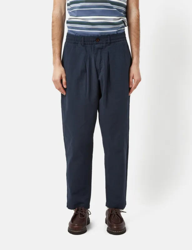 Universal Works Pleated Seersucker Track Pant (Relaxed) - Navy Blue sold by Article London