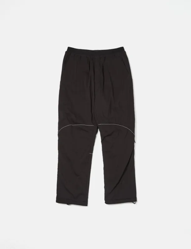 And Wander Alpha Air Pants - Black sold by Article London