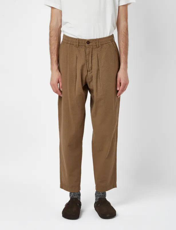 Universal Works Pleated Seersucker Track Pant (Relaxed) - Olive Green sold by Article London