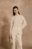 U XS, bolso de ante beige sold by Cortana
