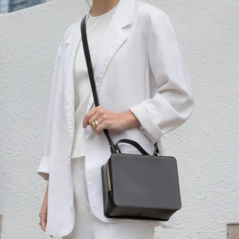 The Box Top Handle Crossbody sold by Minor History