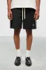 monogram track short black/ecru sold by about:blank