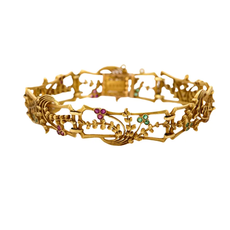 BOUCHERON - Bracelet Art Nouveau rubis, émeraudes, or jaune sold by 58 Facettes