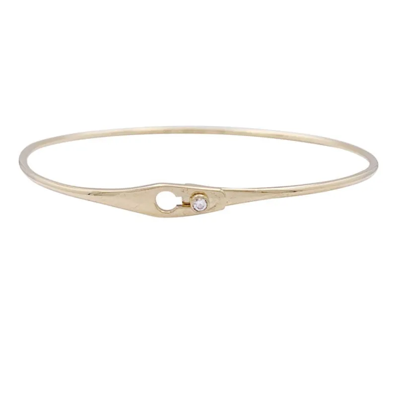 Bracelet Dinh Van, modèle "Serrure" en or jaune, un diamant. sold by 58 Facettes
