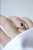Bague marguerite rubis entourage diamants sold by 58 Facettes